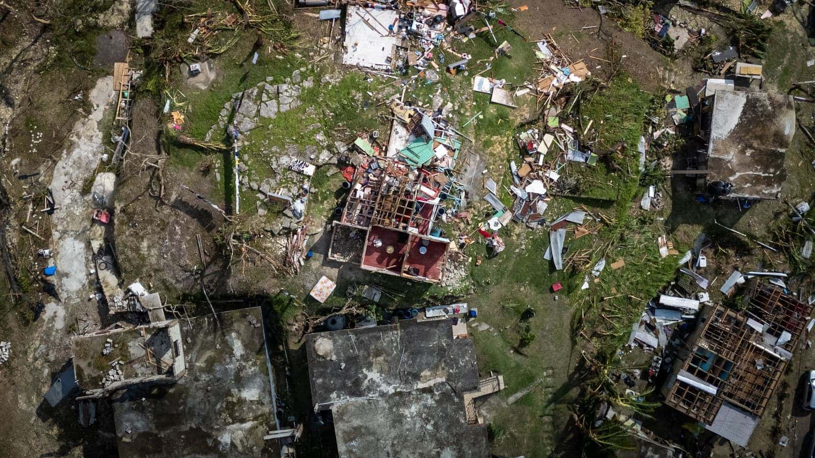 Aerial view of homes damaged by a hurricane